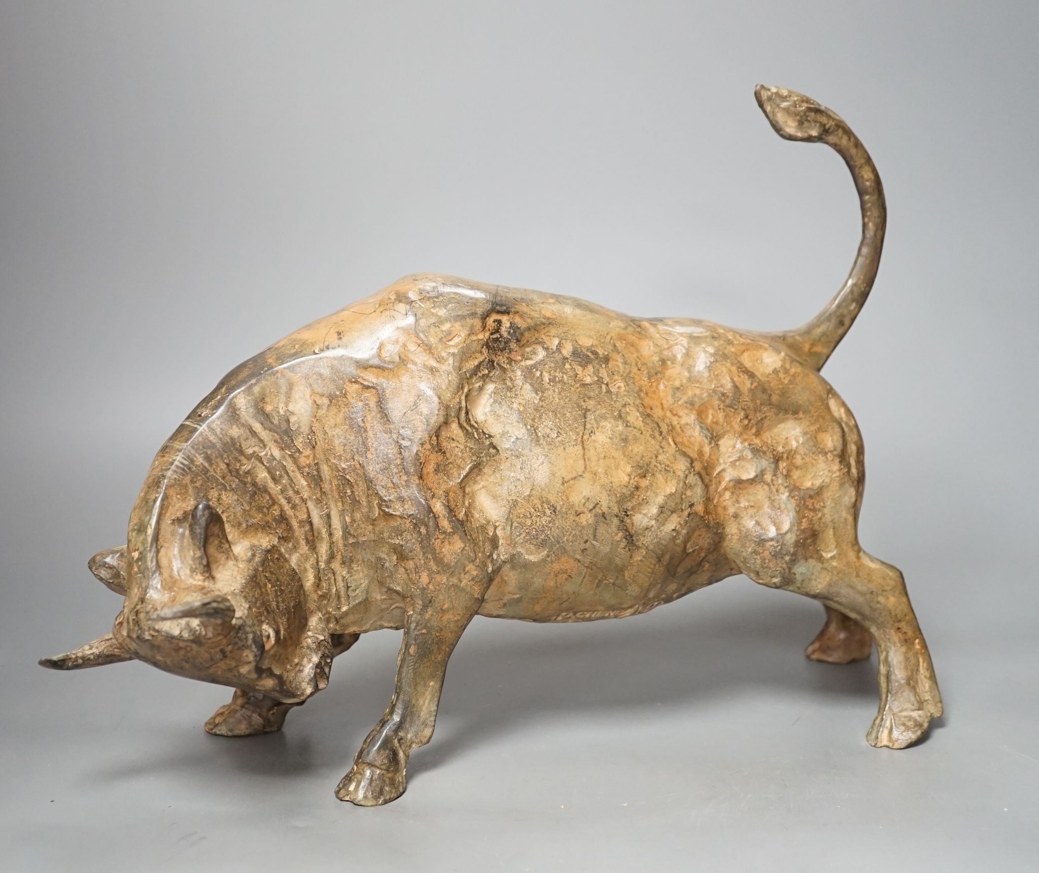 Pierre Chenet Foundry, a patinated bronze of a charging bull, length 39.5cm, signed